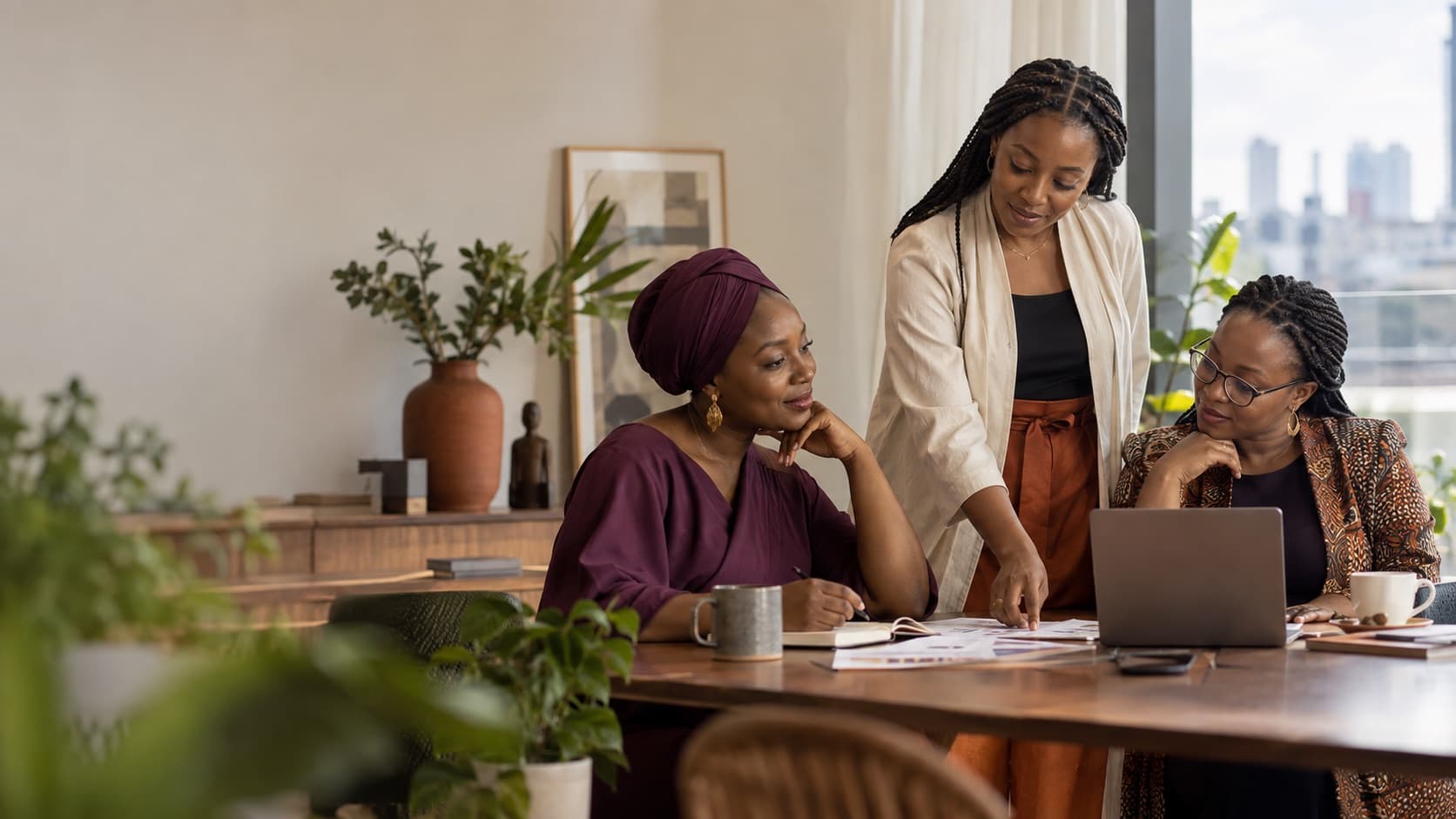 Women learning and working together at a table