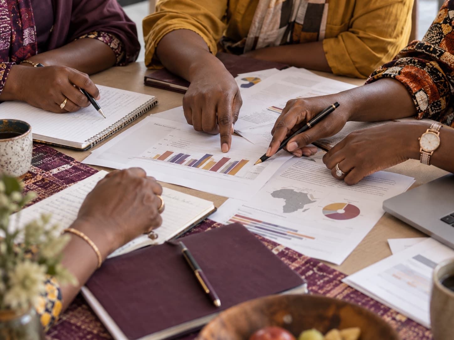Women exchanging ideas and reviewing learning materials